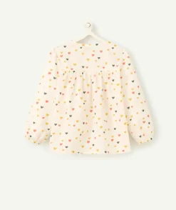 Chemise manches longues bébé fille en coton bio écru imprimé à cœurs colorés