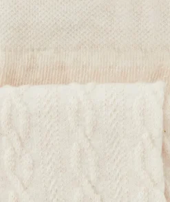 Les collants écrus avec torsades