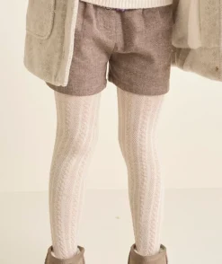 Les collants écrus avec torsades