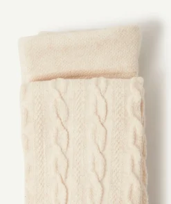 Les collants écrus avec torsades