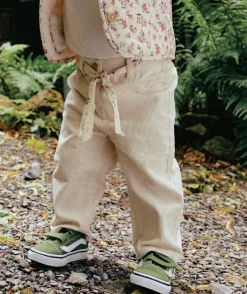 Pantalon bébé fille rose clair avec ceinture fleurie