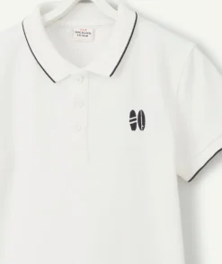 Polo garçon en coton blanc avec surf brodé