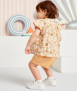 Short bébé fille jaune avec liserés couleur dorée