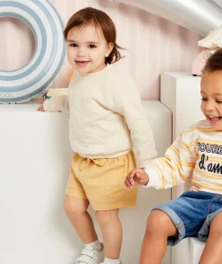 Short bébé fille jaune avec liserés couleur dorée