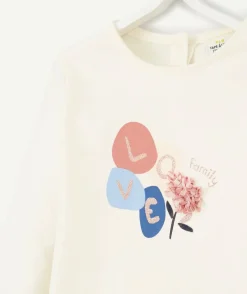 T-shirt bébé fille en coton bio avec messagelove et fleur relief