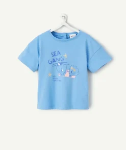 T-shirt bébé fille en coton bio bleu avec motifs coquillages et étoiles pailletées