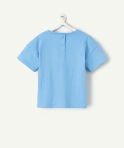 T-shirt bébé fille en coton bio bleu avec motifs coquillages et étoiles pailletées